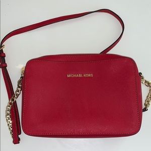 Red crossbody Michael Kors purse